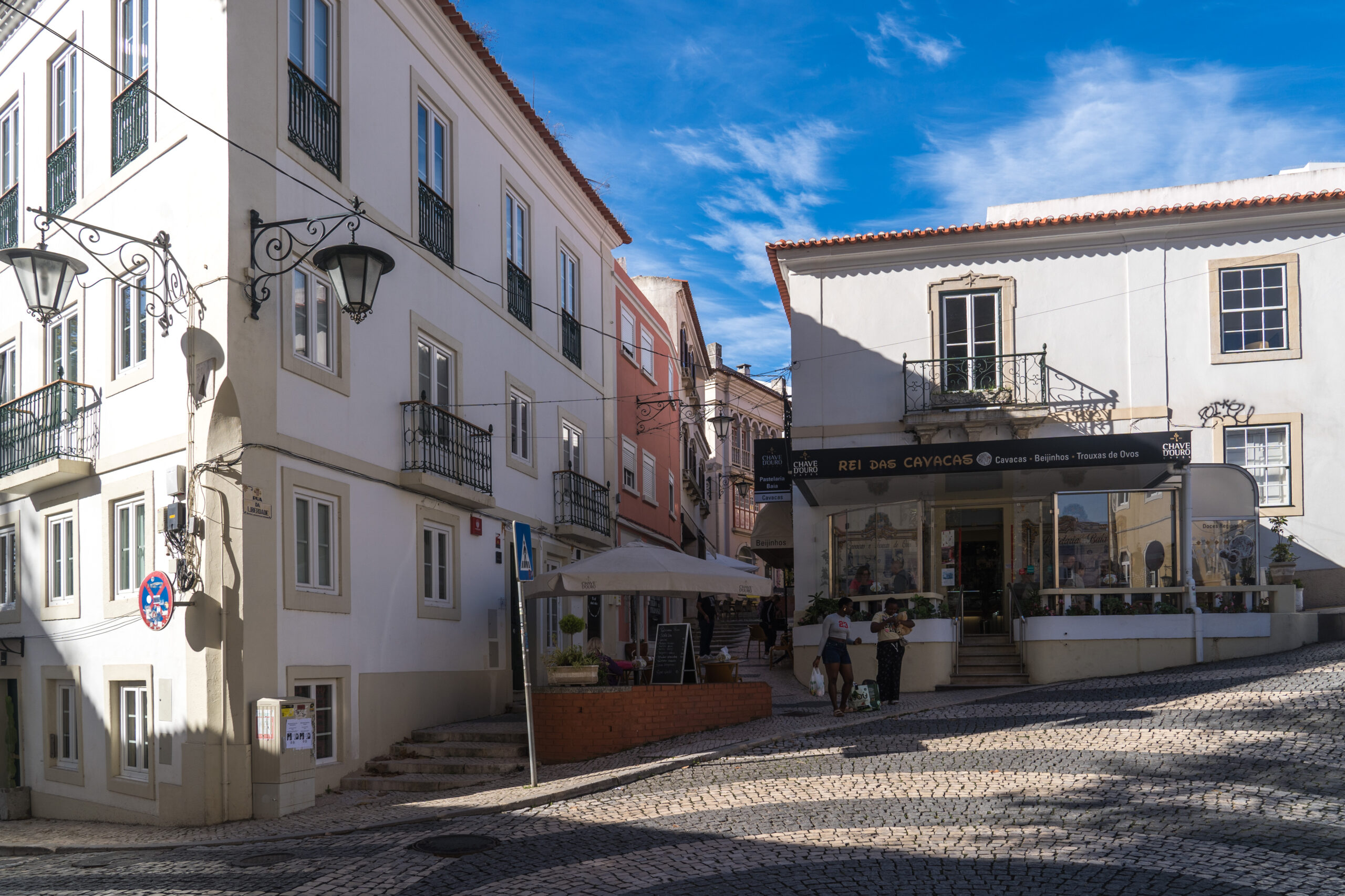 Walkable street in Caldas da Rainha, Portugal, with older buildings, cafés, and everyday errands outside Lisbon.