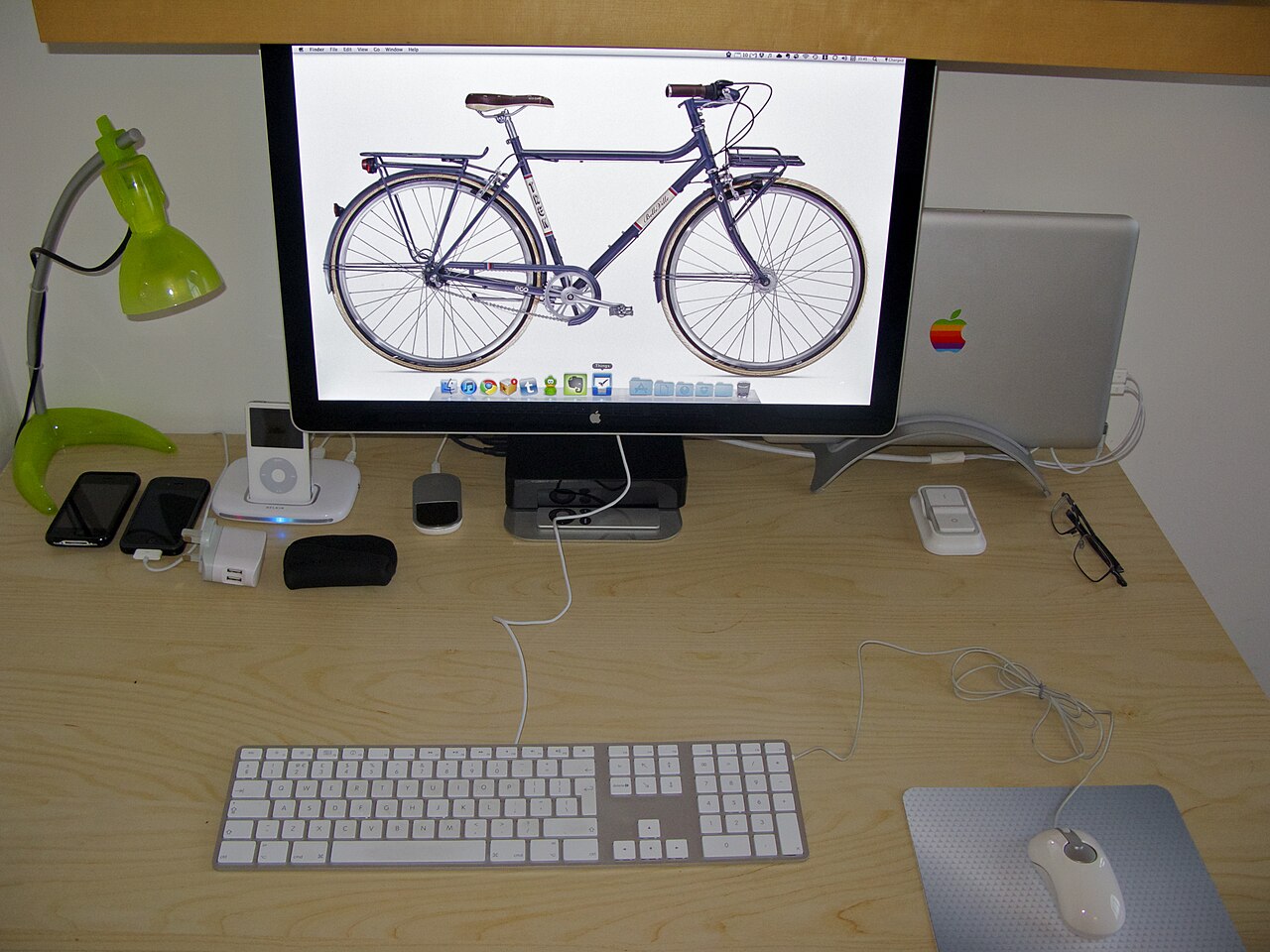 Apartment desk setup with laptop and monitor used to check Wi-Fi, phone signal, and daily admin after arrival abroad.