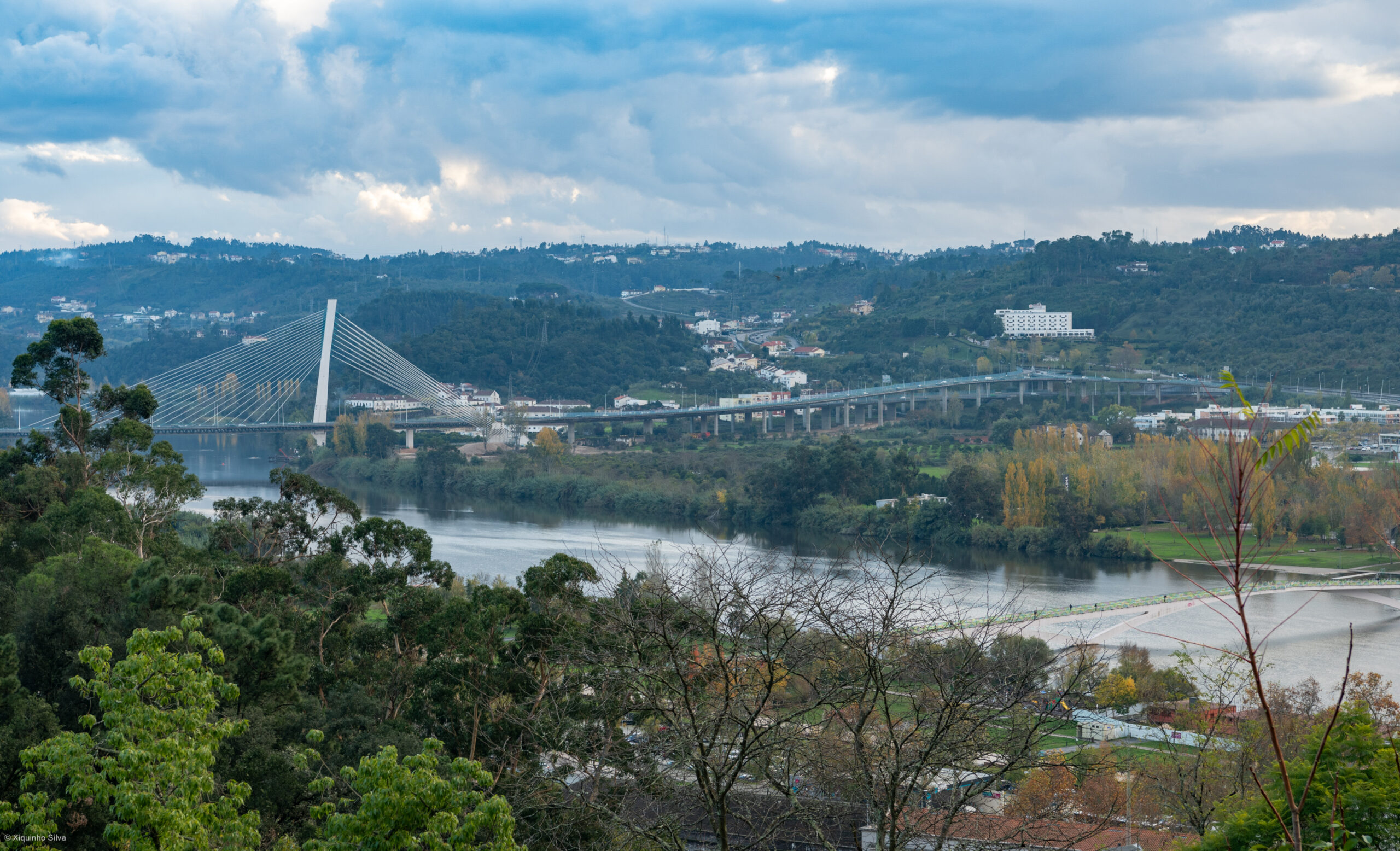 Coimbra rising above the river with its old town and university skyline.