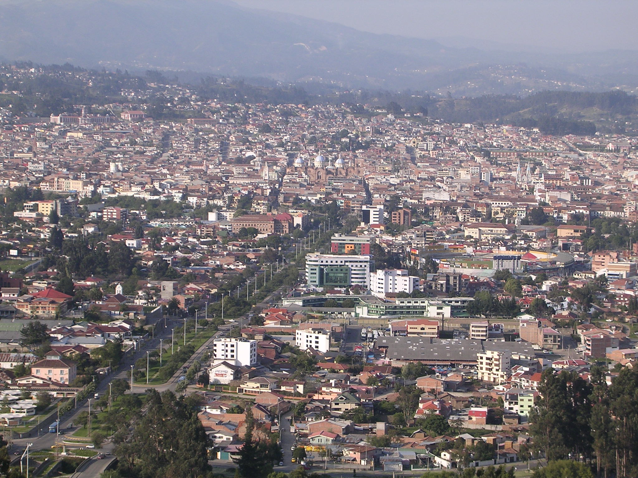 Panoramic daytime view of Cuenca from the Turi overlook with the city spread across the valley.