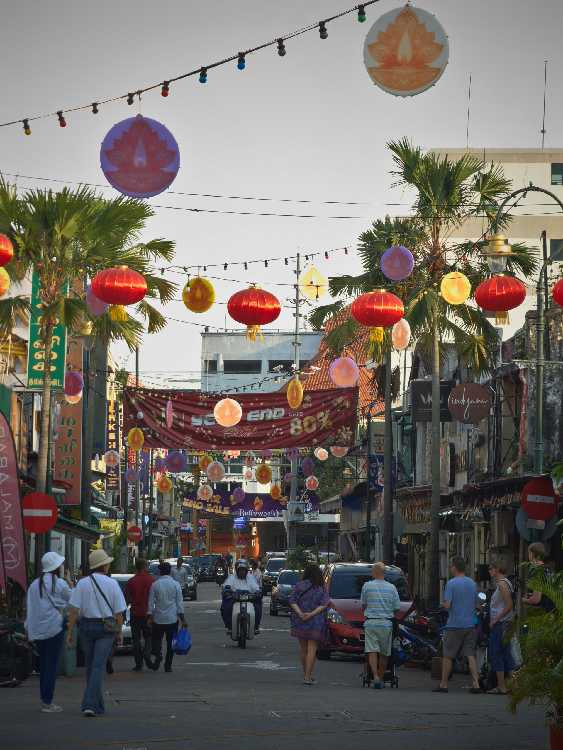 Market Street in George Town, Penang with historic shophouses, parked vehicles, and an everyday neighborhood feel.