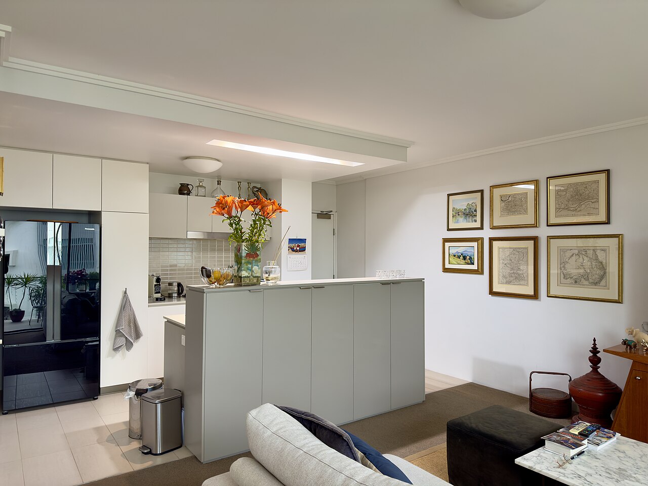 Compact apartment kitchen with cabinets, counter space, sink, and everyday cooking basics.