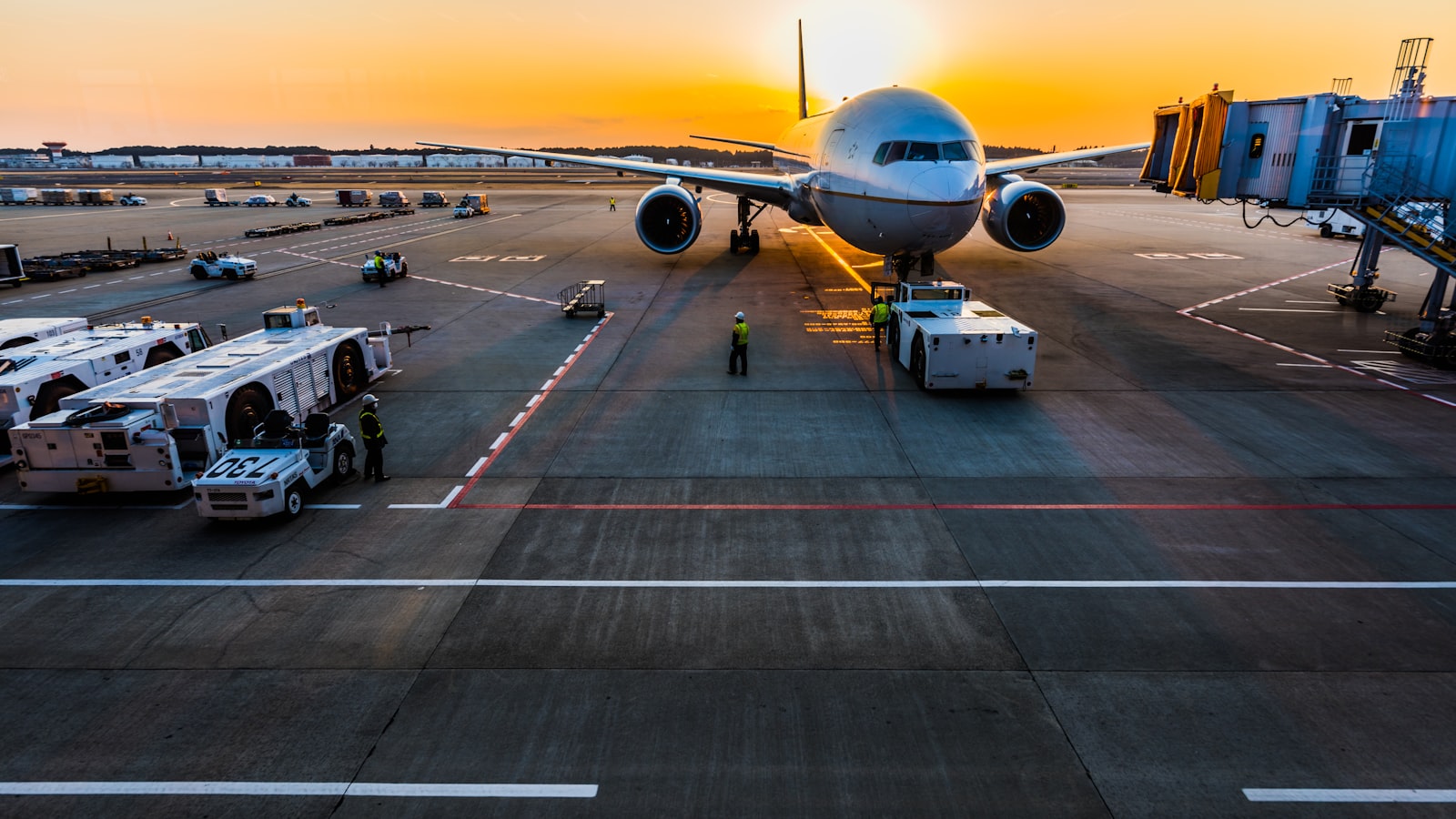 Traveler pulling luggage through a transit space.