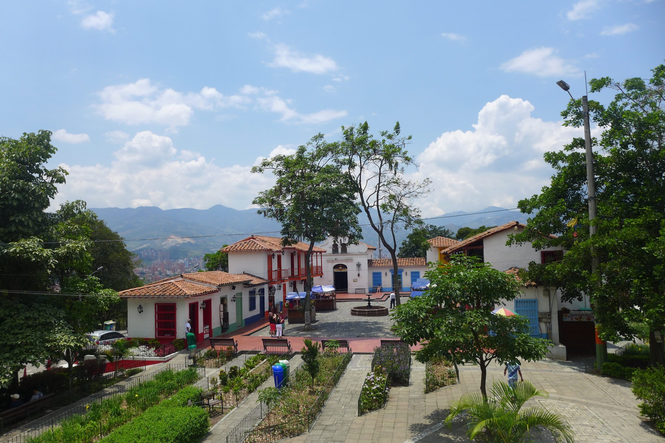 Pueblito Paisa viewpoint area overlooking Medellín from Cerro Nutibara on a bright day.