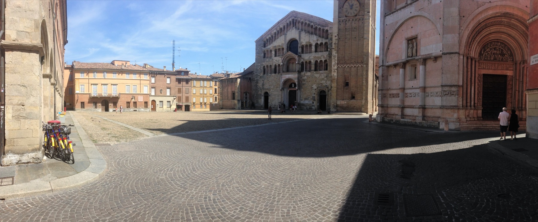 Panoramic view of Parma Piazza del Duomo with historic cathedral buildings.