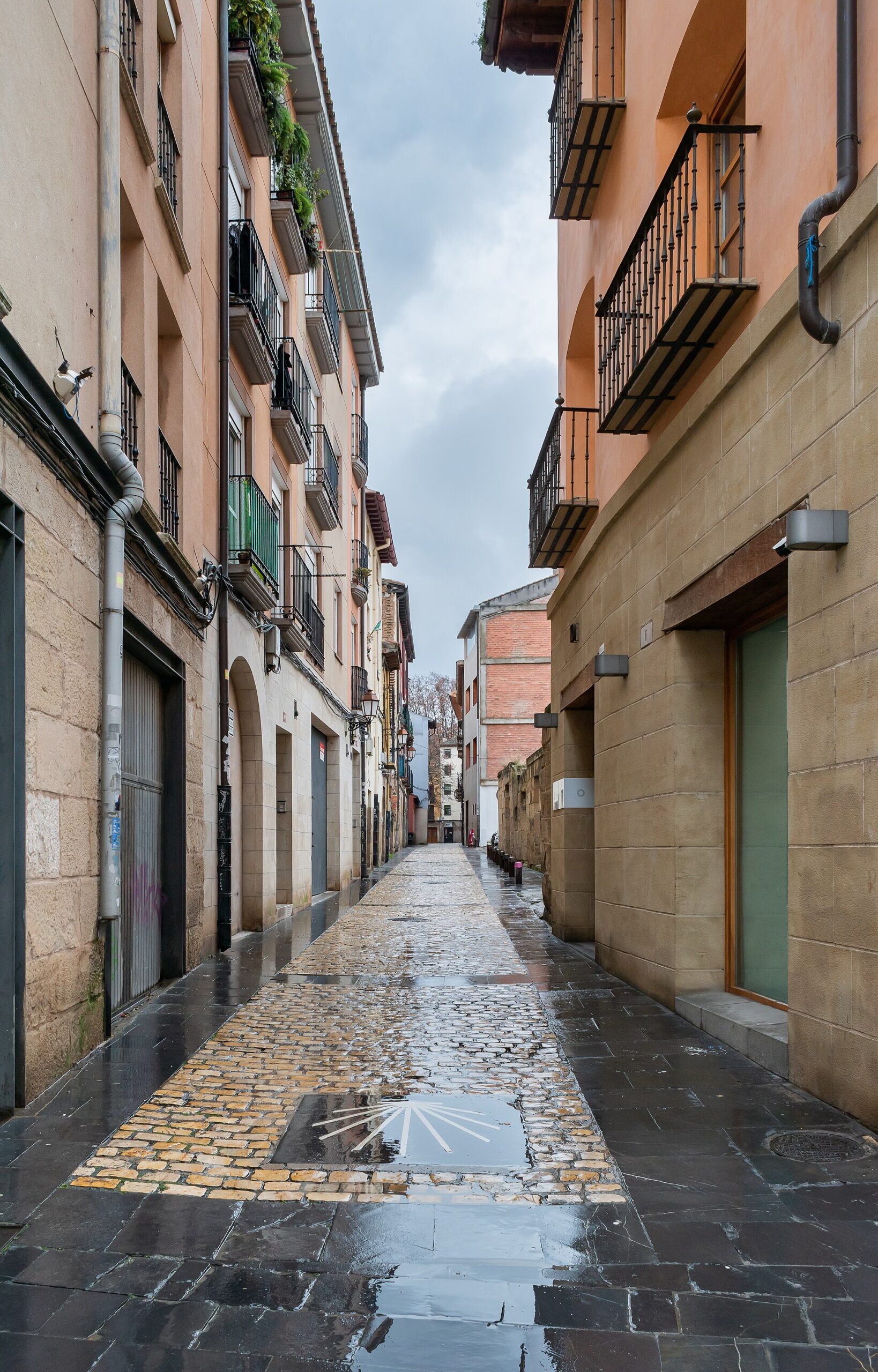Stone street in Logrono, Spain with traditional buildings, outdoor seating, and a quieter small-city rhythm.