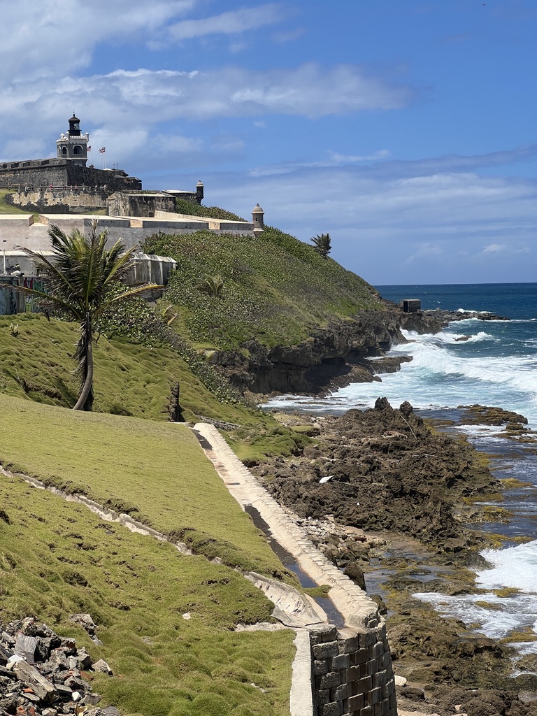 Coastal fort and blue water, used as a bright travel contact-page image