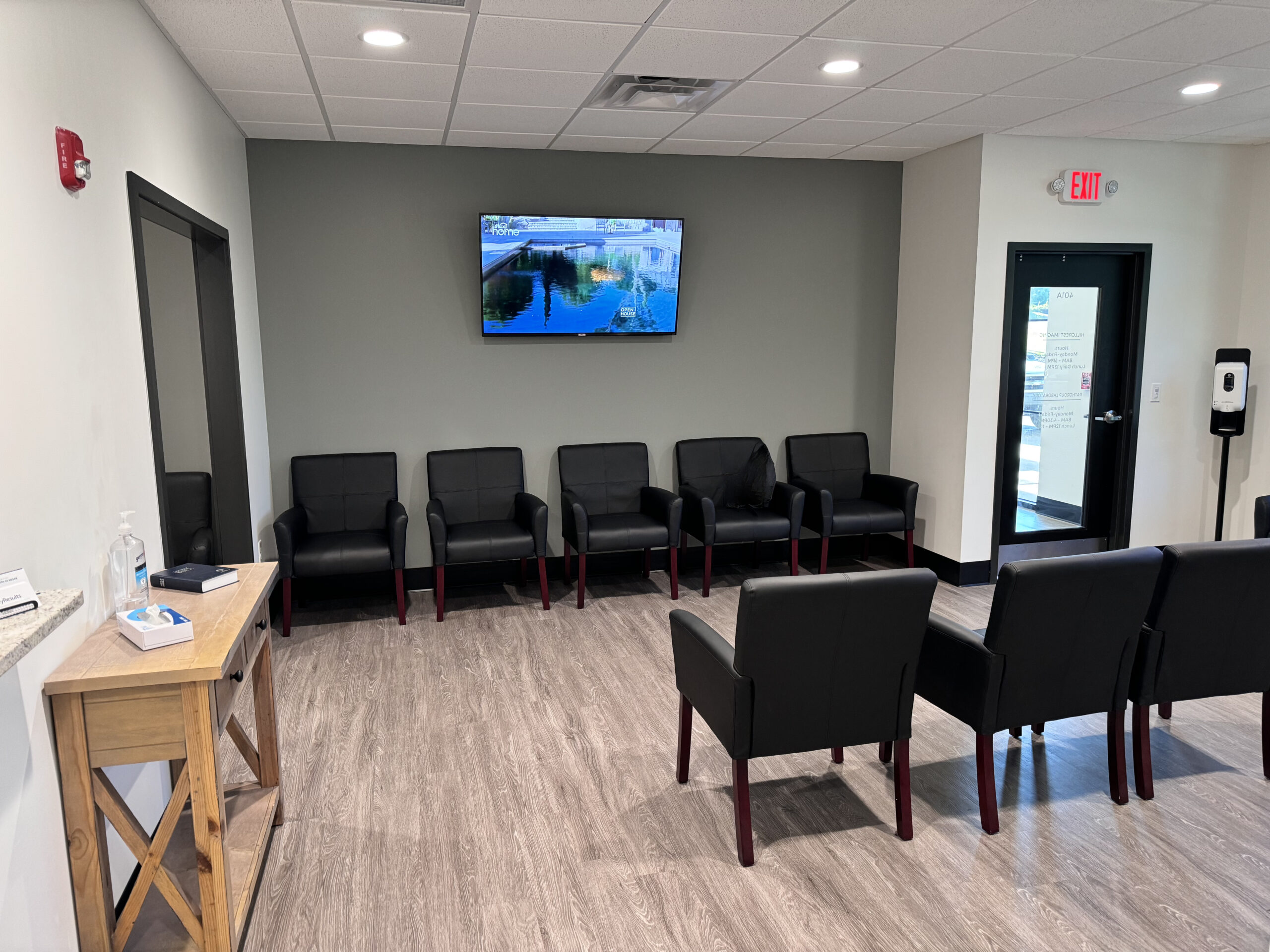 Empty medical clinic waiting room with chairs and a front desk, representing local care options abroad.