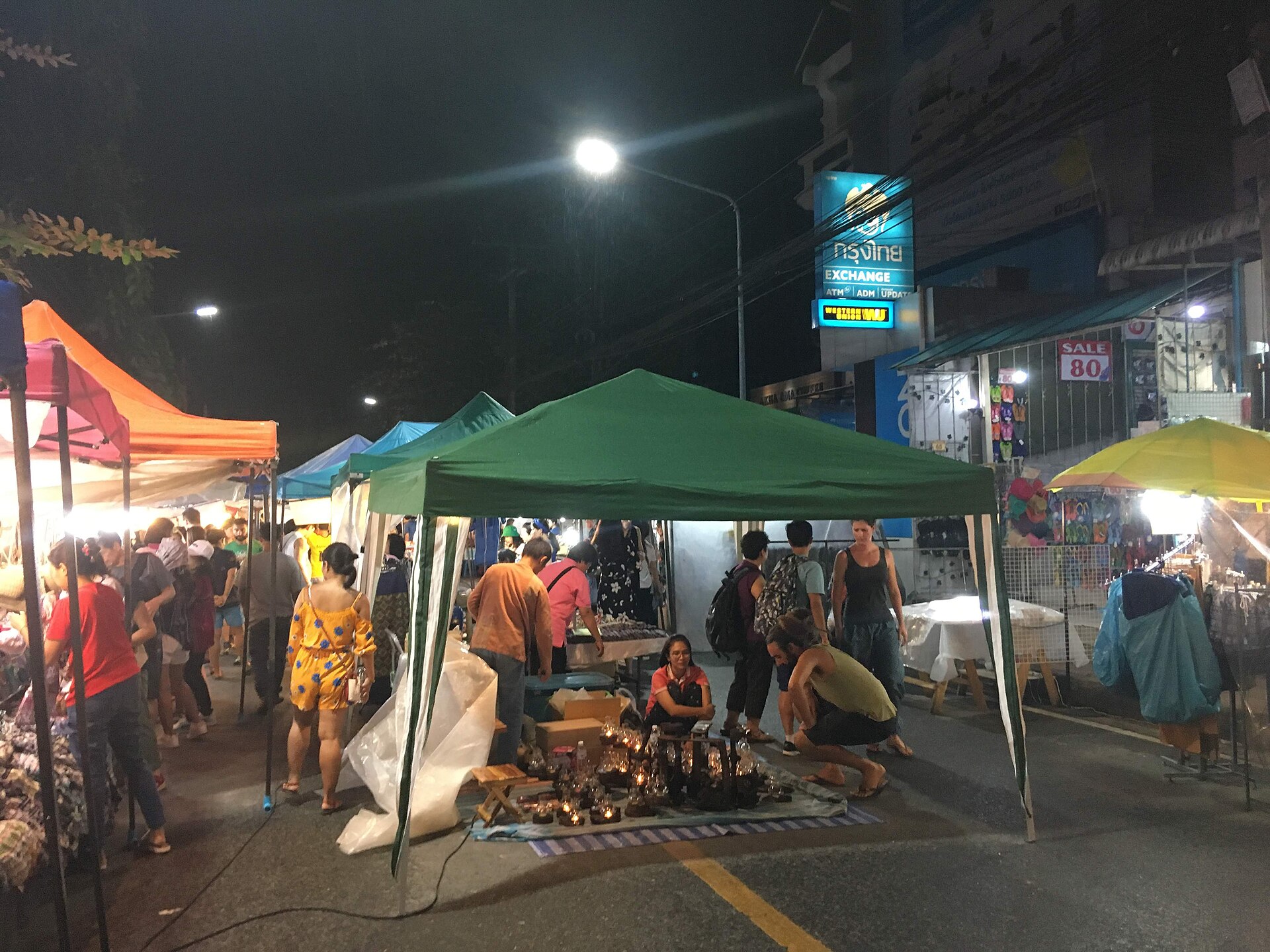 Crowds and stalls at the Chiang Mai Sunday Night Market in Thailand.