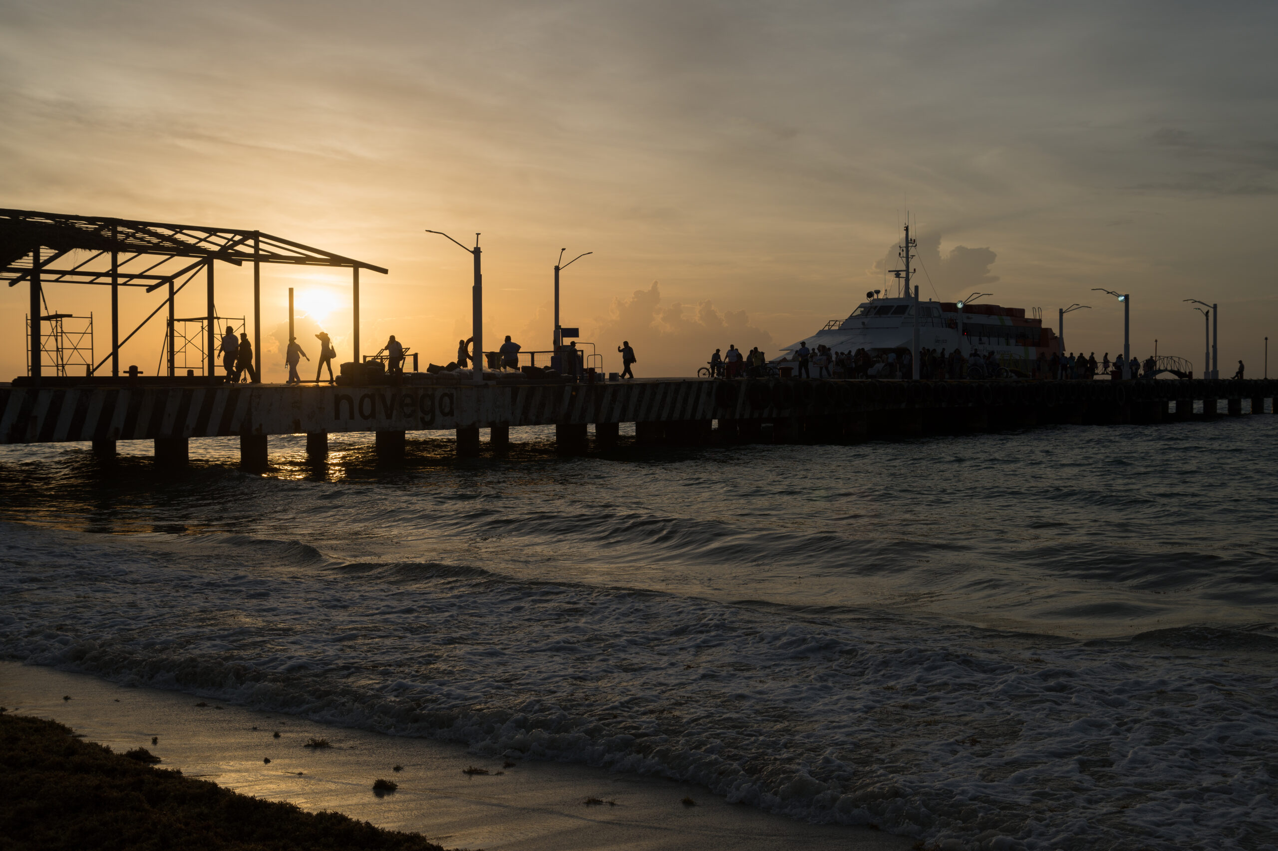 A ferry near Playa del Carmen at sunrise.