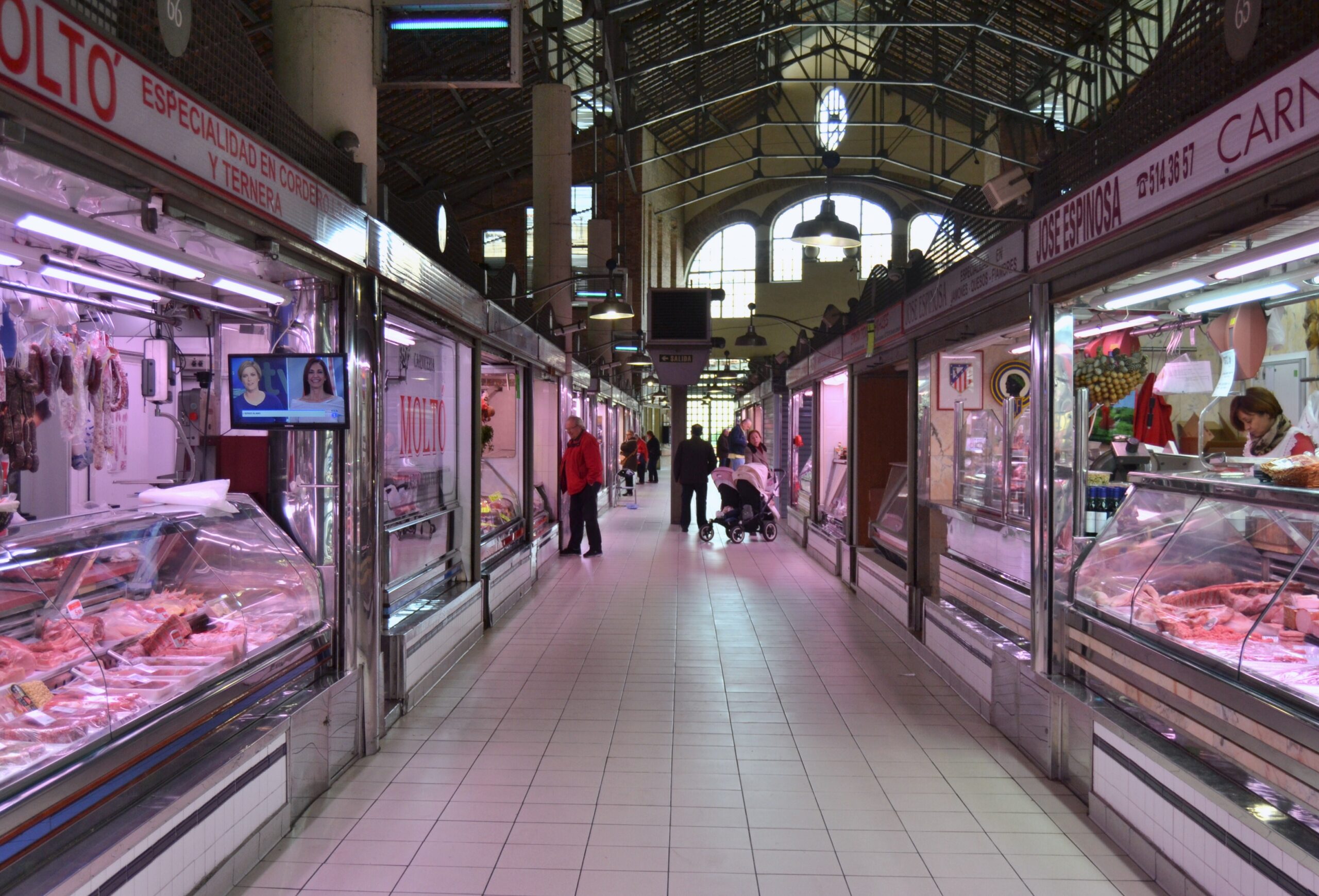 Interior aisle at Alicante Central Market, showing ordinary grocery routines that shape a realistic Alicante monthly budget.