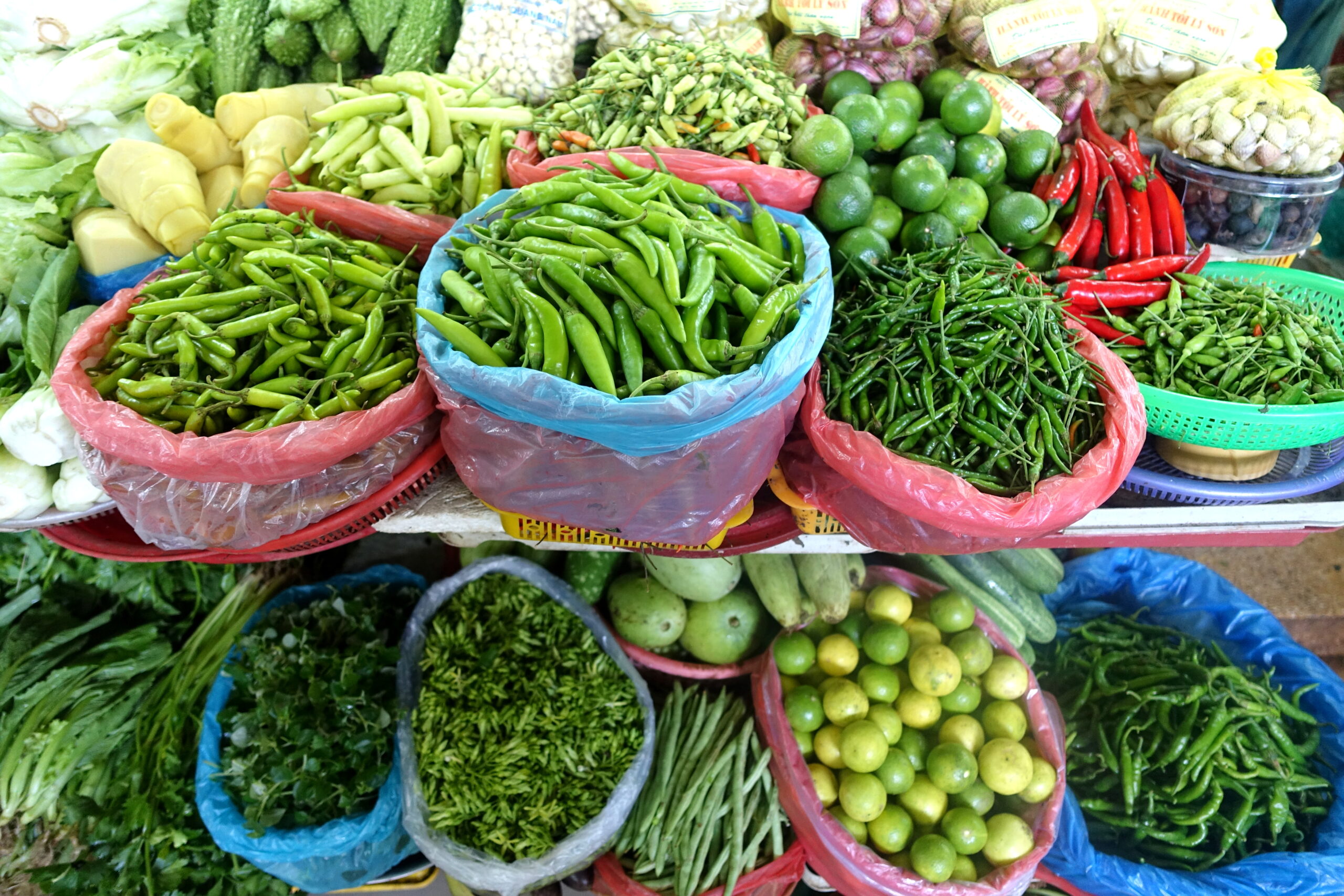 Produce stalls inside Han Market in Da Nang, Vietnam, showing the grocery and daily-food side of a realistic Da Nang monthly budget.