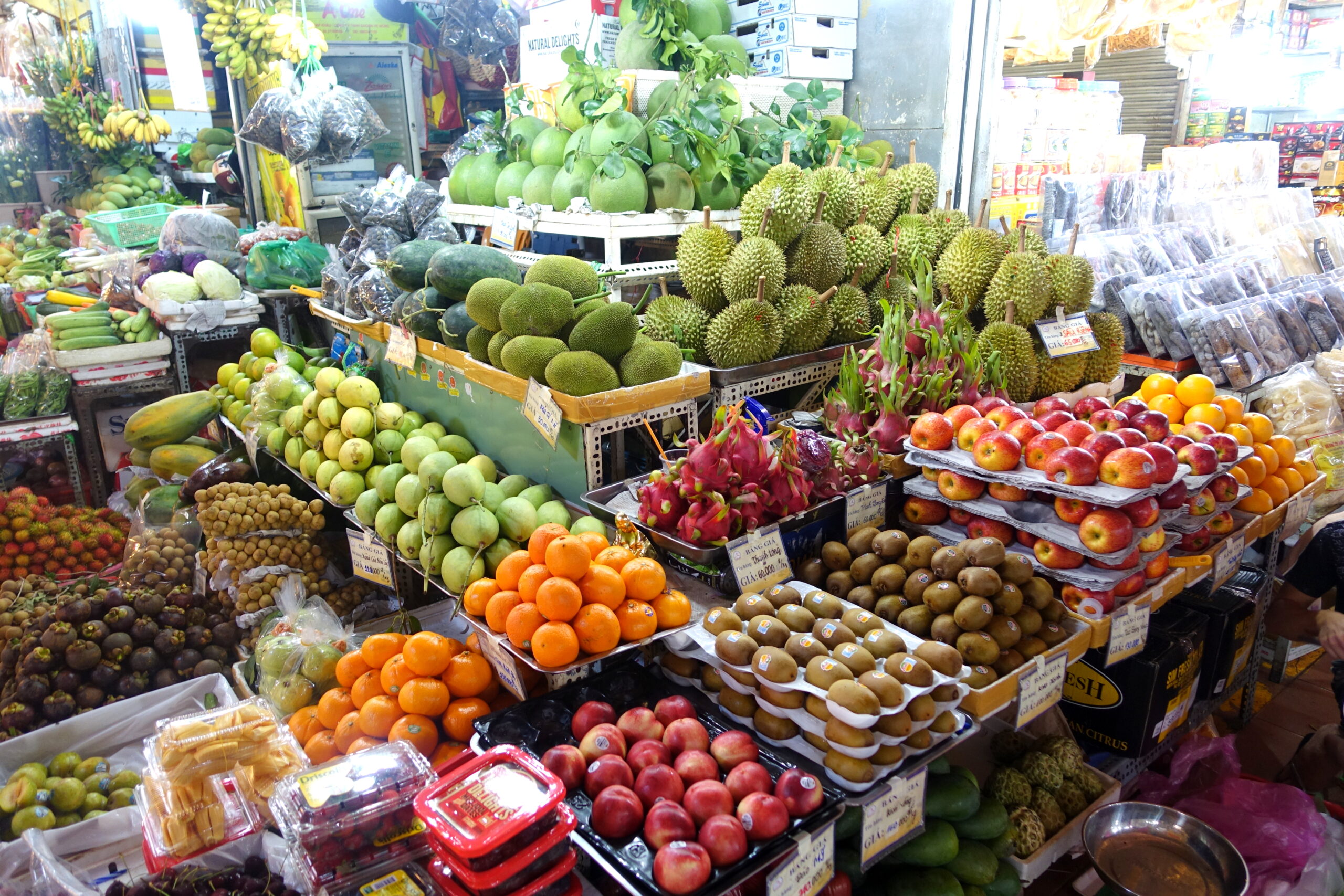Produce in Ben Thanh Market in Ho Chi Minh City, Vietnam, showing the grocery and daily-food side of a realistic monthly budget.