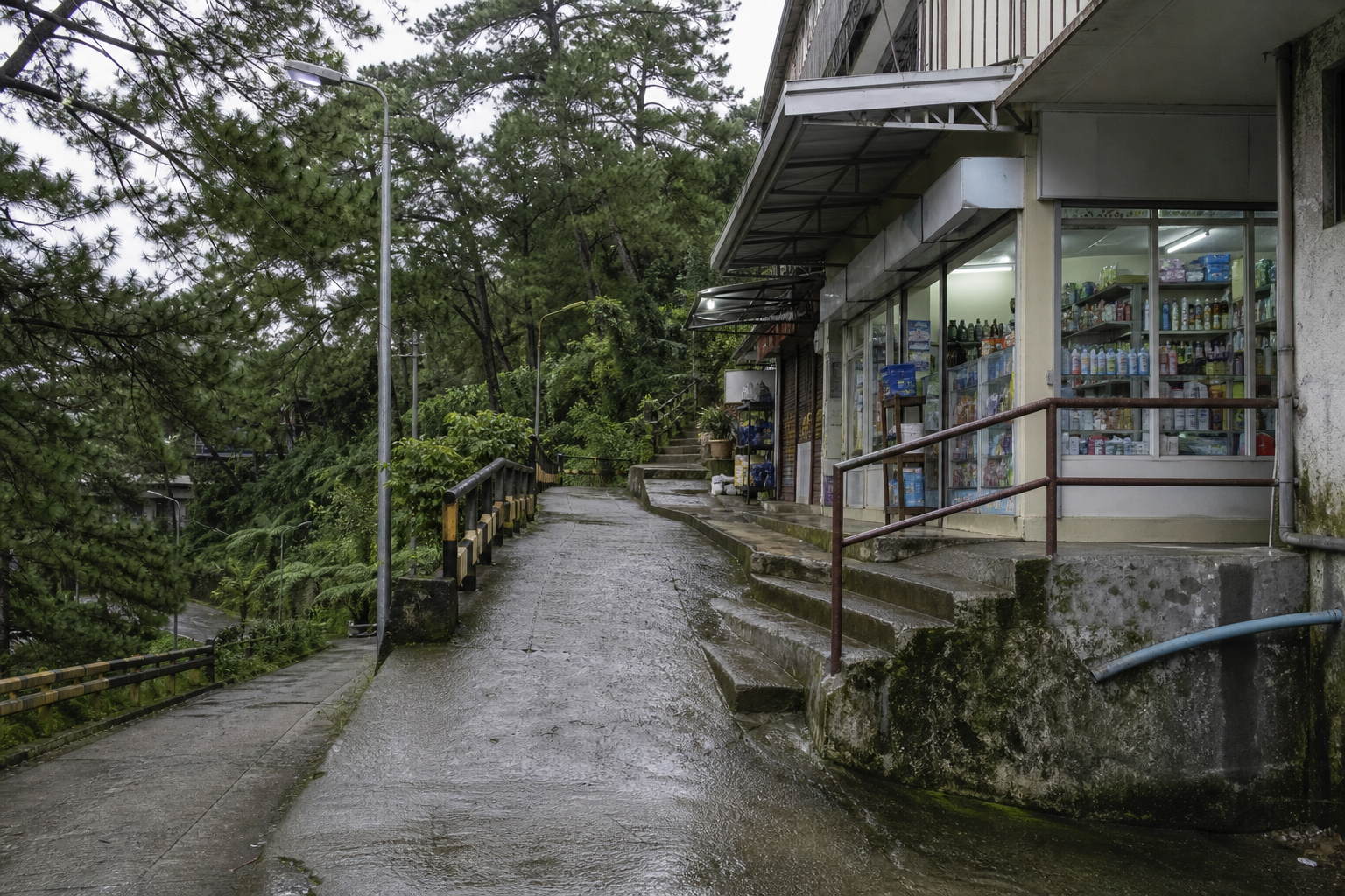 Illustrative steep, wet Baguio errand route beside a small neighborhood shop.