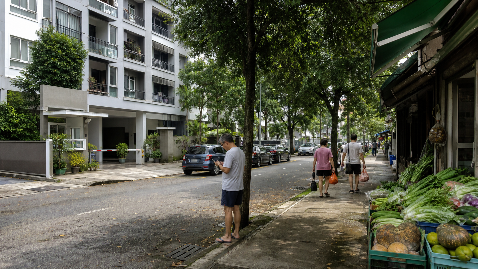 Illustrative Penang apartment entrance beside a shaded sidewalk and neighborhood produce shop.