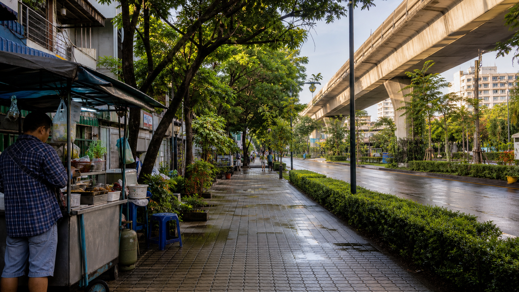 Illustrative shaded Bangkok sidewalk beside a small food stall, apartments, and elevated transit after rain.