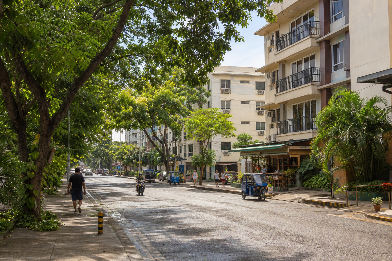 Leafy Davao neighborhood with apartments, local services, and ordinary daily movement.