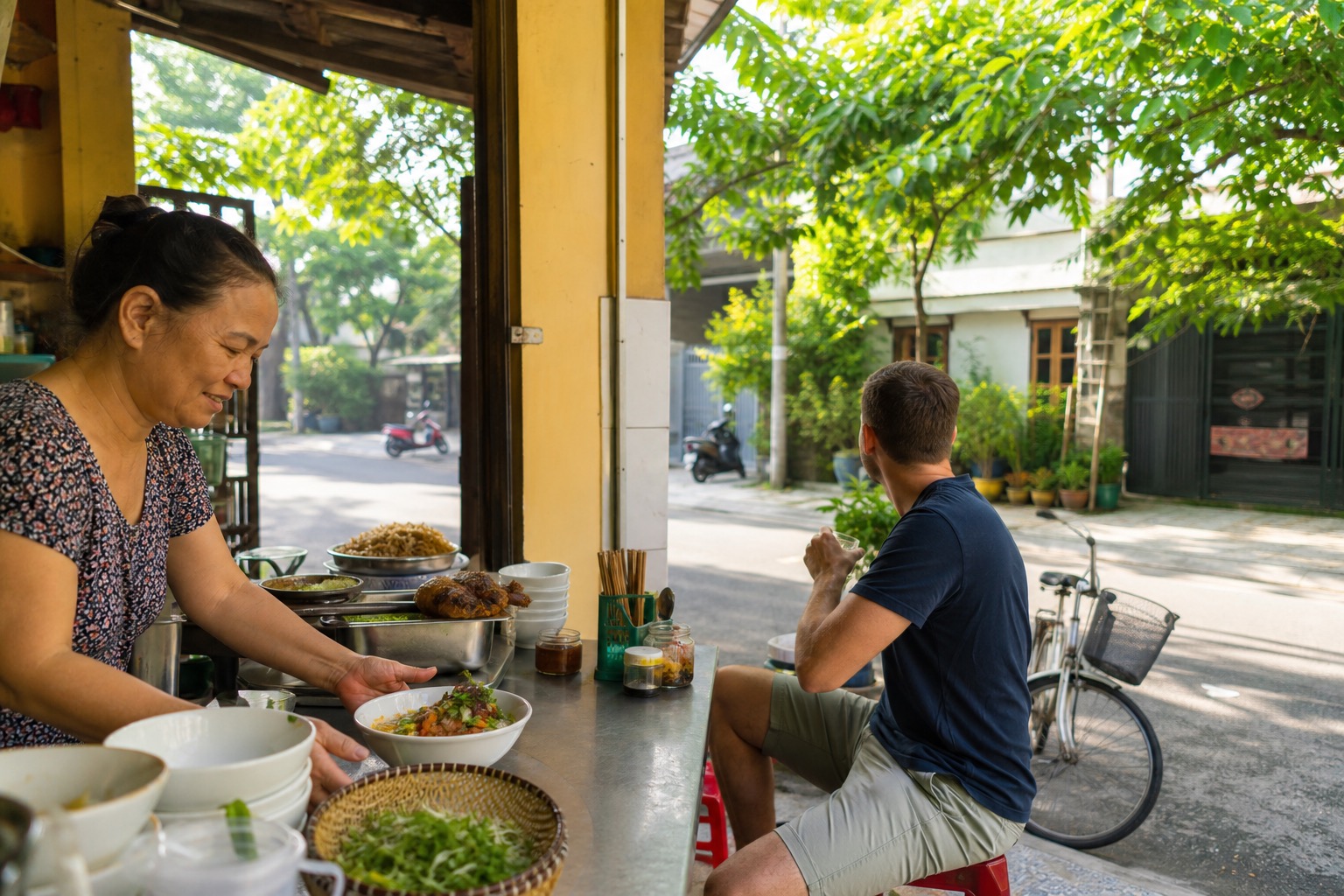 A traveler checks a phone and notebook over Vietnamese coffee beside a bright Da Nang street.